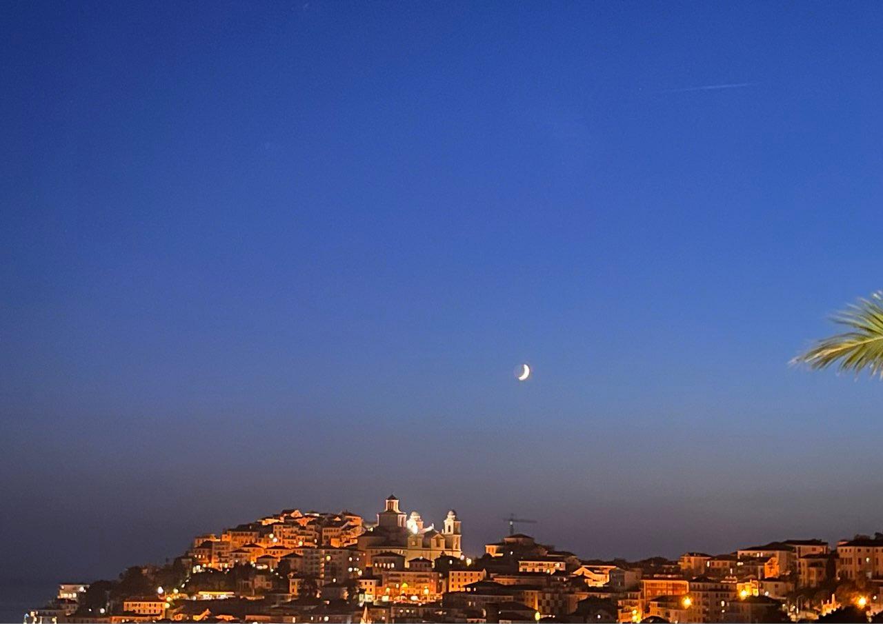 The Moon over Imperia, Italia — first quarter, Lunar Day 6
